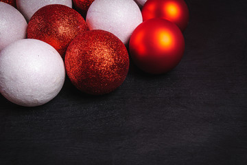 red and white baubles on a black wooden table
