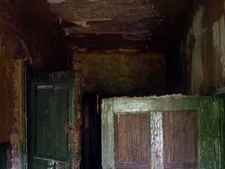 Fototapeta na wymiar corridor of an abandoned building deserted, abandoned premises, open doors, awful place