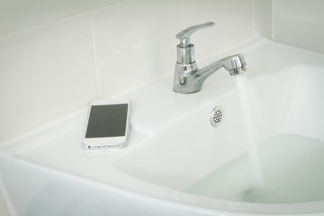 phone fell.The phone fell into the basin