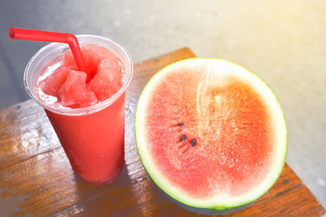 watermelon smoothies on the wood background