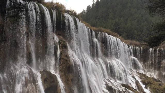 Grand  Great waterfalls at Jiuzhaigou National Park  where is the UNESCO World Heritage in Sichuan , China in  Autumn in November located in  in  Tibetan-Qiang of Sichuan ,China