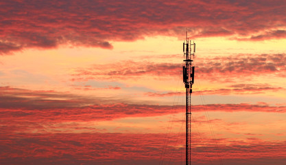 Communications tower with a beautiful sunset sky