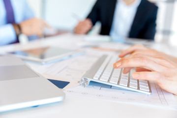 Image of woman's hands typing