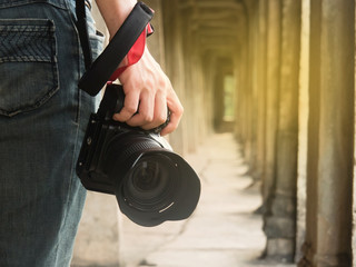 Photographer holding his camera
