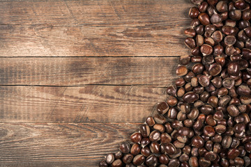 Chestnut on wooden background