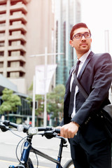 Young businessmen with a bike