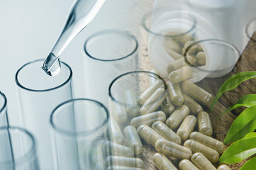 double exposure of science laboratory test tubes and herbal caps