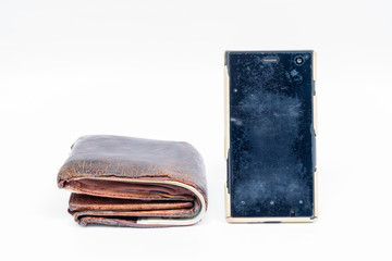 Old wallet brown leather and dirty smart phone