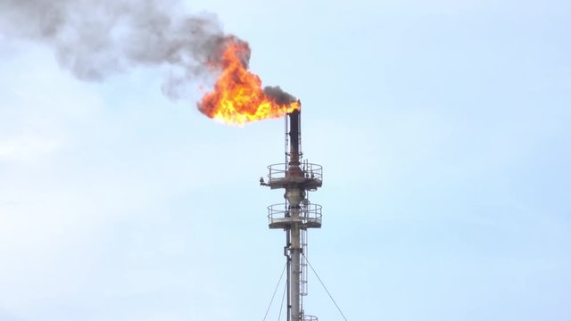 Flame from oil refinery tower 