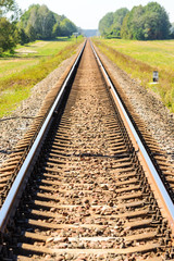 Fototapeta premium Railroad tracks stretching into the distance.