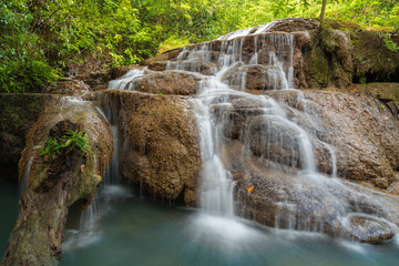 Fototapeta na wymiar Waterfall in deep forest , Erawan waterfall National Park
