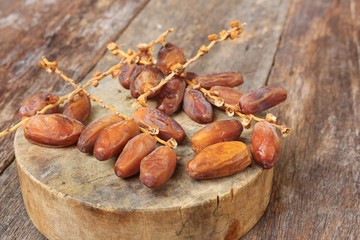 Dried date palm. fruit  Delicious fresh organic date palm on wooden background. 