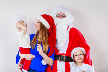 Happy family together with Santa Claus.
