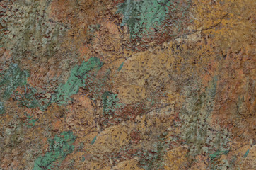 old spotty stained concrete wall texture background. color orange, green, gray