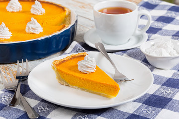 slice of Pumpkin tart - traditional dessert for festive dinner