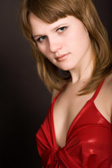 Naklejka premium young girl in a red dress