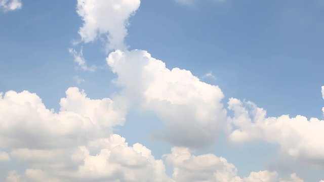 Fluffy white clouds on sky with a bright ,Slow-moving,Time Lapse.