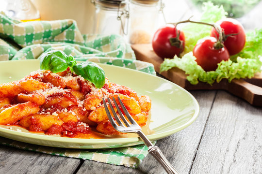 Italian gnocchi with tomato sauce and cheese