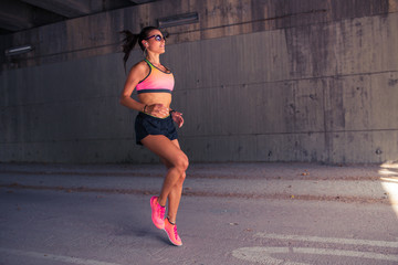 Fototapeta premium Fit woman runner warming up outdoors