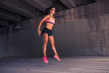Fototapeta na wymiar Fit woman runner warming up outdoors