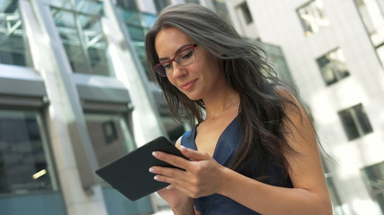 Tablet computer business woman Beautiful young professional businesswoman smiling happy.