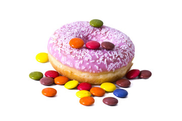 Donut with sprinkles and smarties isolated