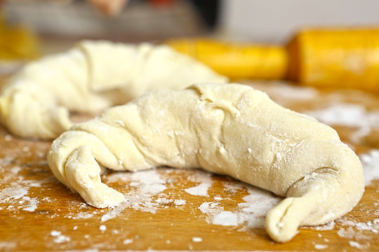Croissant still raw on the coking board