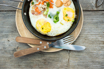 pan egg on wooden table, breakfast