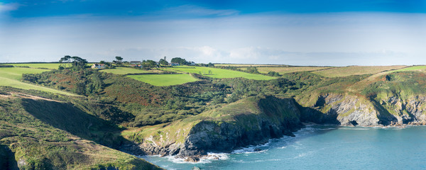 Panoramic view with farmhouses and the Epphaven cove near Port Quin in north Cornwall.