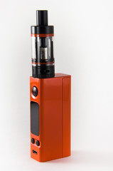 Orange E-cigarette or vaping device. Close up.