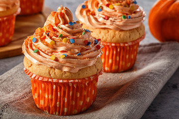 Pumpkin cupcakes with glitter sugar sprinkles.
