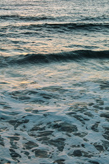 Sunset reflections on the ocean surface