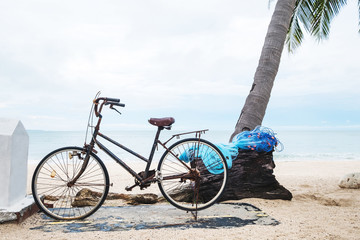 Fototapeta premium Old rusty bicycle parking at the beach