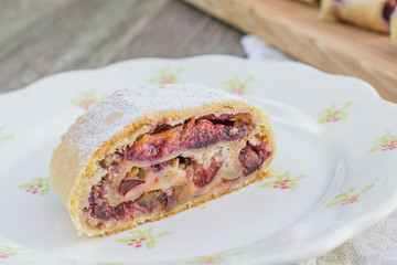 One piece Plum strudel on white Plate