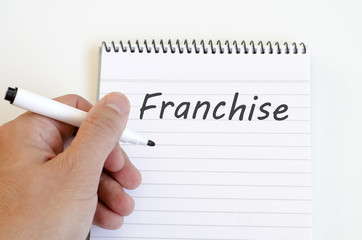 Franchise text concept on notebook