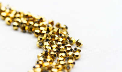 Golden glass beads