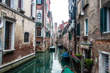 Fototapeta na wymiar Water canal in venice with boats in Italy