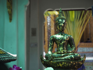 front view of old buddha statue with motion blur of background from thailand summer holiday travel trip