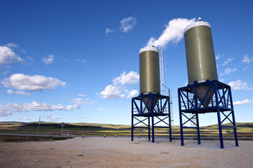 Obraz premium Two hoppers containing salt, to prevent snow on the roads