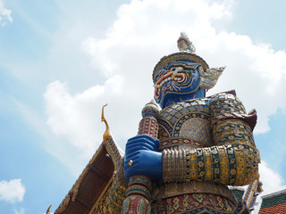 gold ring of blue big giant statue with gold color of pavilion at thailand temple summer holiday travel trip