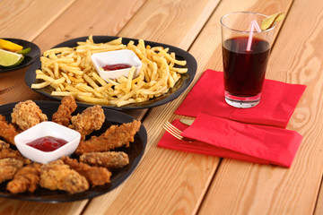 Grilled chicken on a plate standing the wooden table