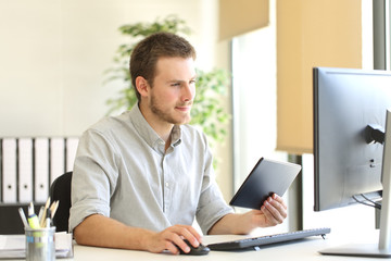 Businessman working with tablet and computer