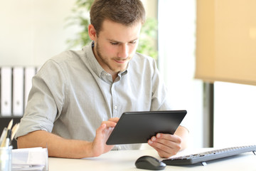 Entrepreneur working on line with a tablet