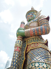 Fototapeta premium big green giant statue at thailand temple summer holiday travel trip