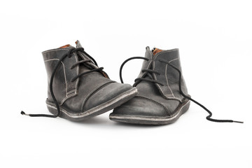 Old Black male shoes isolated on white