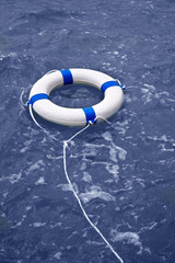 Buoy, lifebelt, lifesaver floating in ocean as help equipment