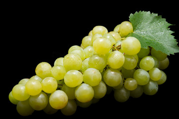 Bunch of ripe muscat grapes on black background