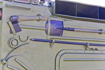 Military transport with shovel, ax and scrap