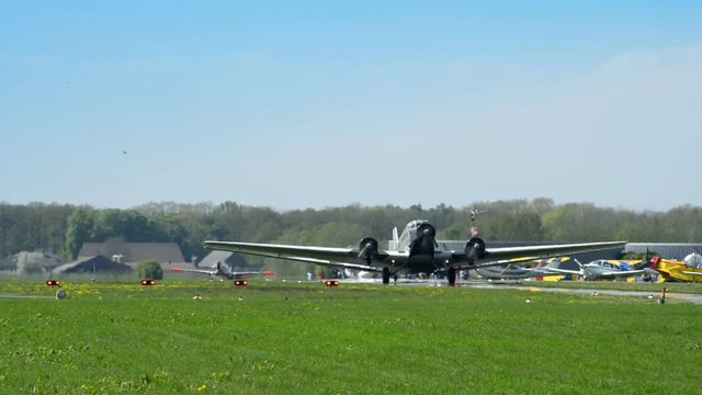 10909 historic airplane Junkers JU 52 roll on taxiway
