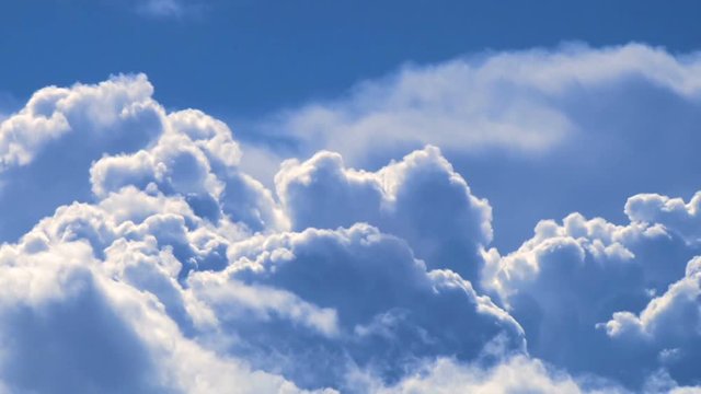 Large thunderhead storm clouds growing as storm becomes more intense, time lapse with vivid blue filter.